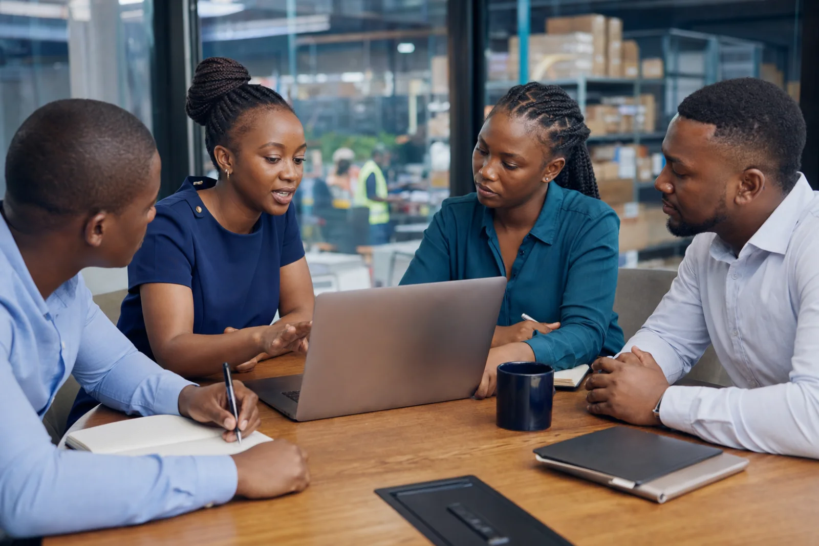 Ugandan ERP consultant guiding a client team through implementation